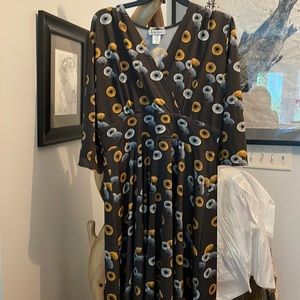 Gray dress with geometric shapes in blue orange and yellow